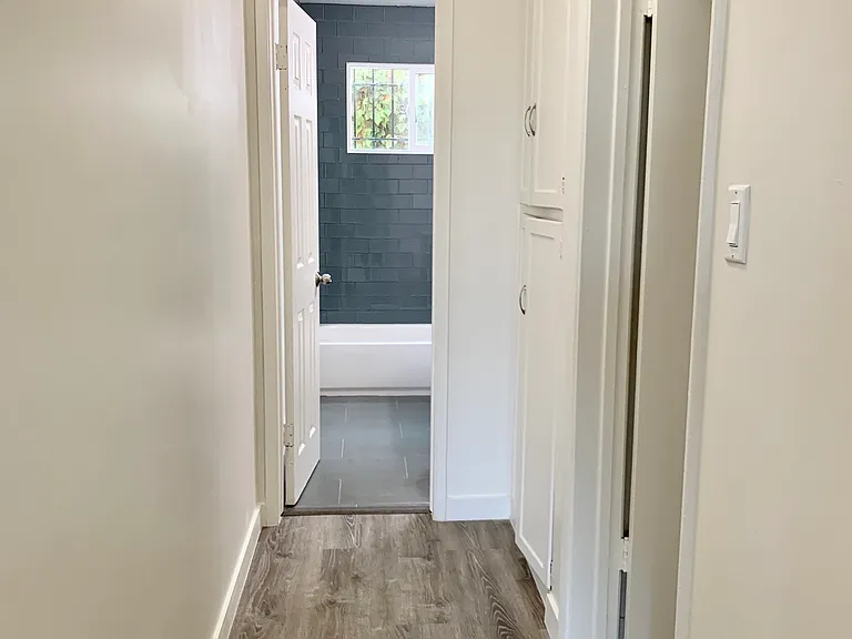hallway to bathroom and bedroom and storage closet