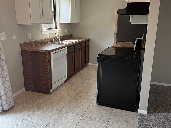 Another view of kitchen and dinning room