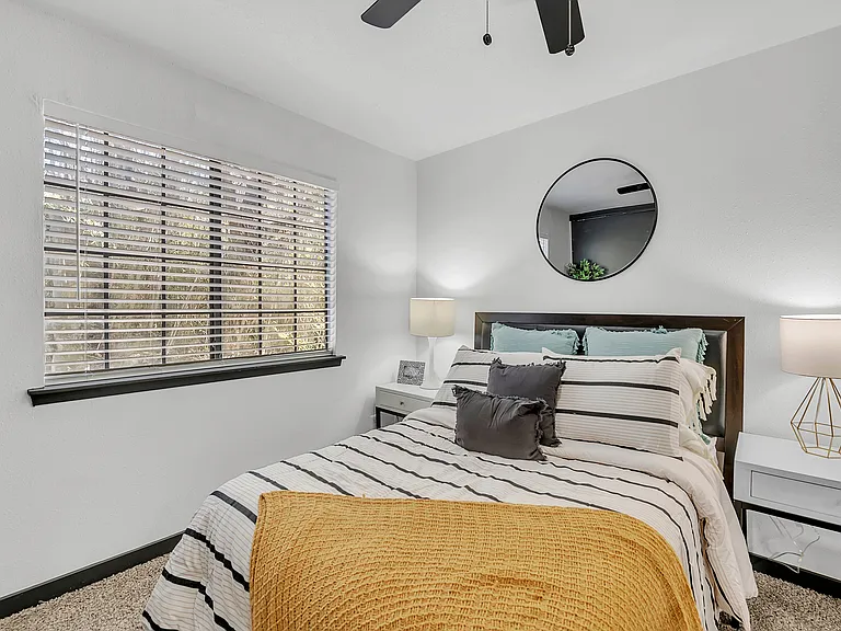 Experience comfort and style in this tastefully decorated bedroom.