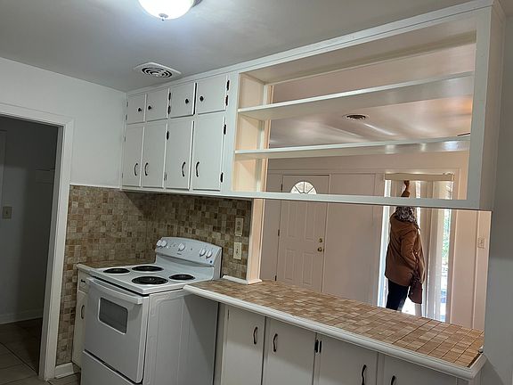 Partial view of kithen with new electric stove