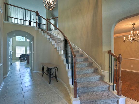 The Winding StairCase makes for a Regal View Upon Entering the Home.