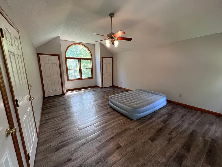 Primary bedroom and queen size bed to show scale of room. It is very large!