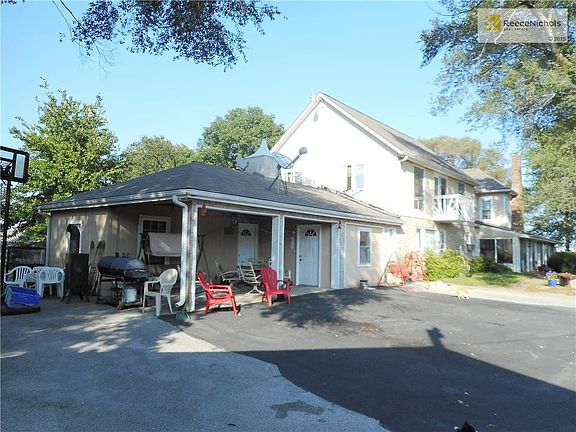 This carport was partially finished to include a 5th bedroom with a sitting room.