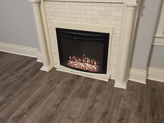 Original fireplace mantel with electric fireplace for ombionce