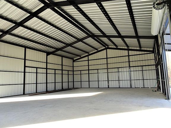 Huge metal building equipped with plumbing and framing for loft