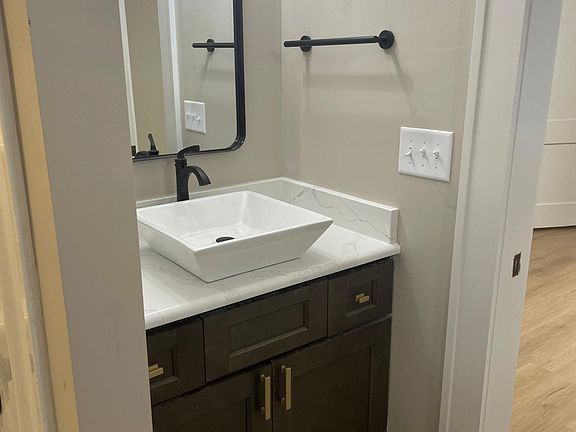 ONE OF TWO VANITIES IN BATH