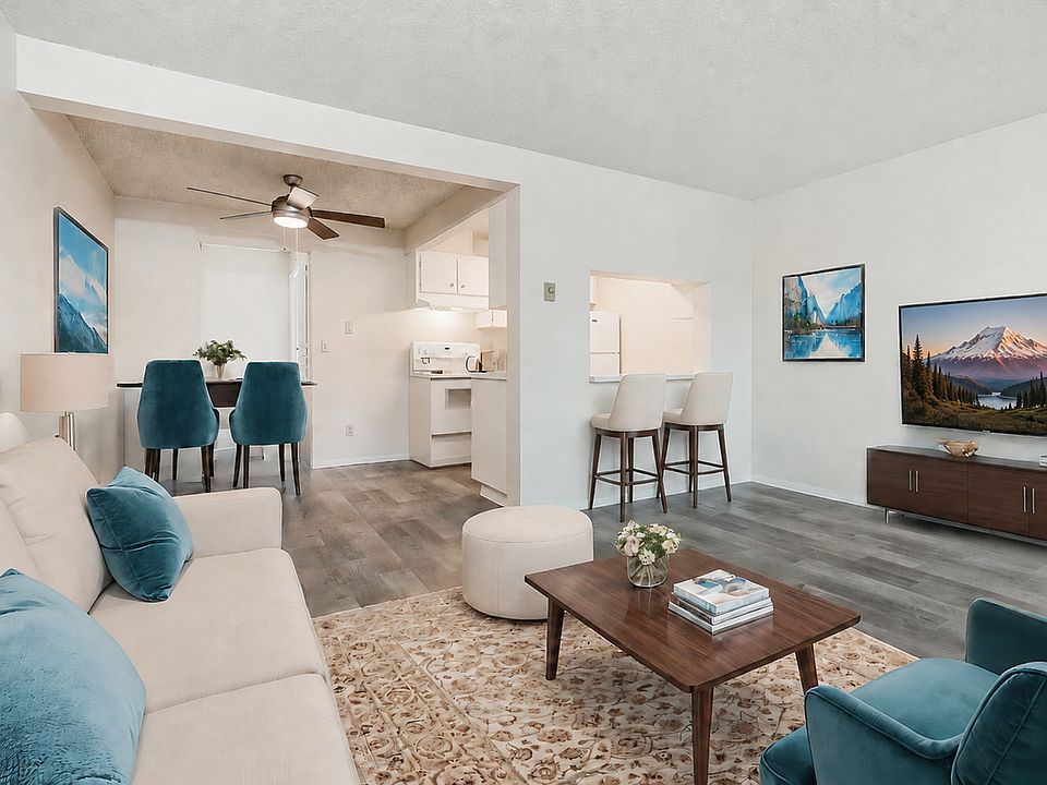Discover bright, modern living at Boardwalk at University Place Apartments, with an open-concept kitchen, comfortable living space, and stylish renovated interiors.