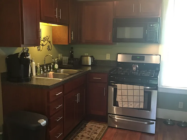 kitchen shown with previous tenants furnishings