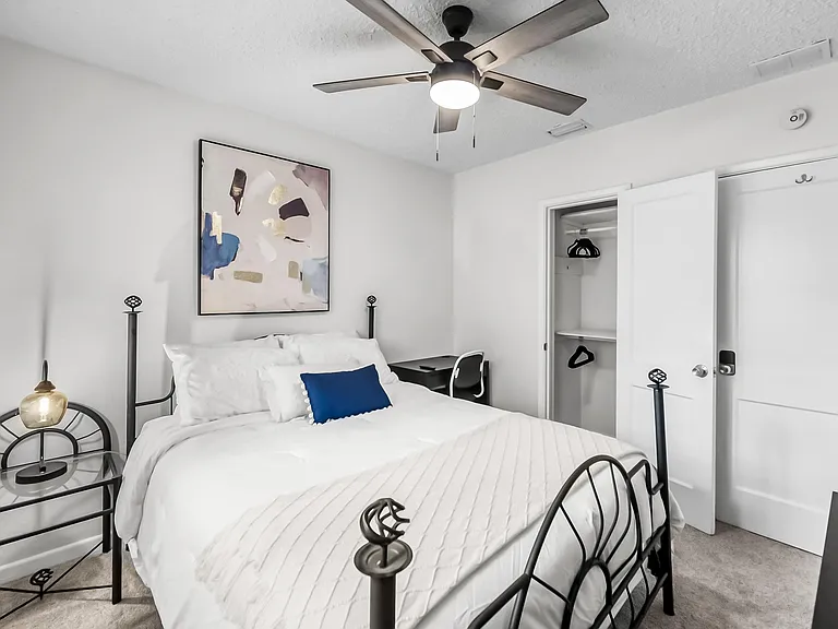 Queen bed, work station and closet