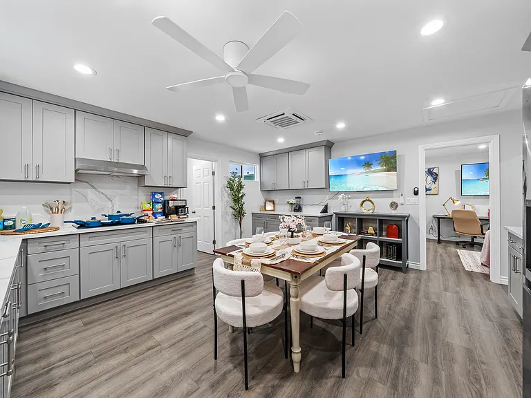 Enjoy your meals at the cozy dining space with easy access to kitchen appliances and essentials.