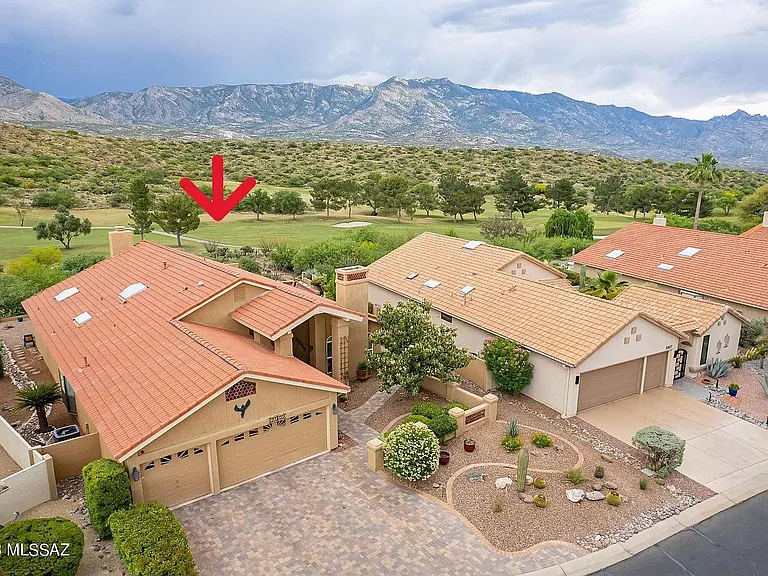 Perched above 9th fairway of Saddlebrooke course with no homes behind! 3 car garage