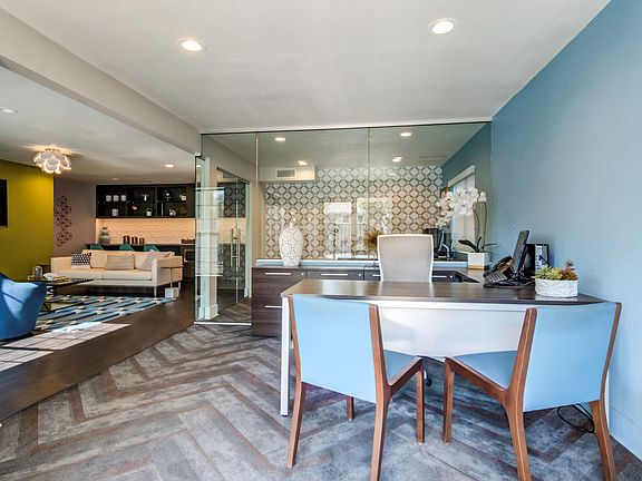 Leasing office with coffee bar and seating area.