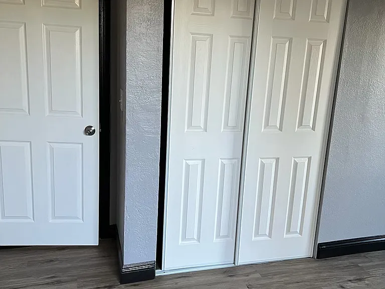 Bedroom entarance door and closet doors.