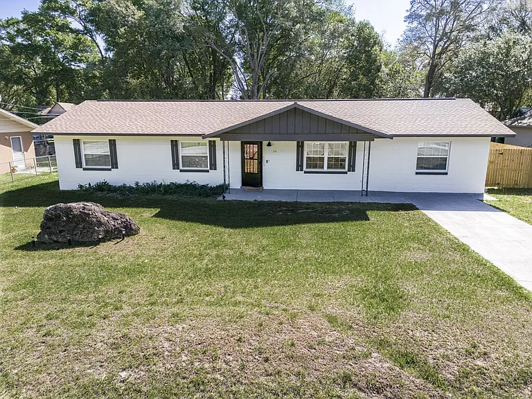 Front of the house with an extended drive way