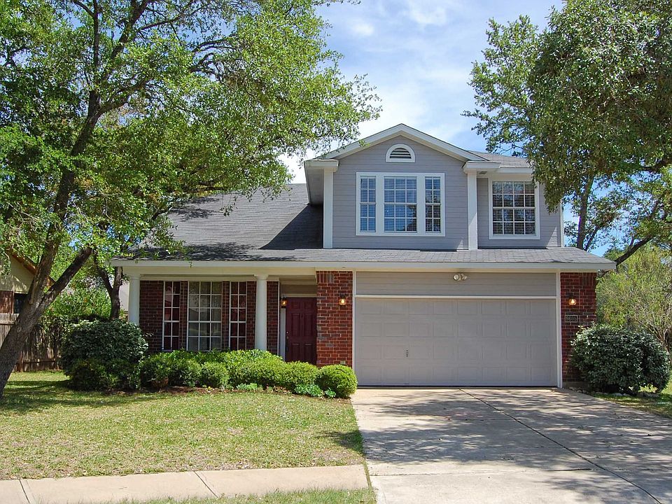Red brick masonry, multi-pane windows and handsome columns. 