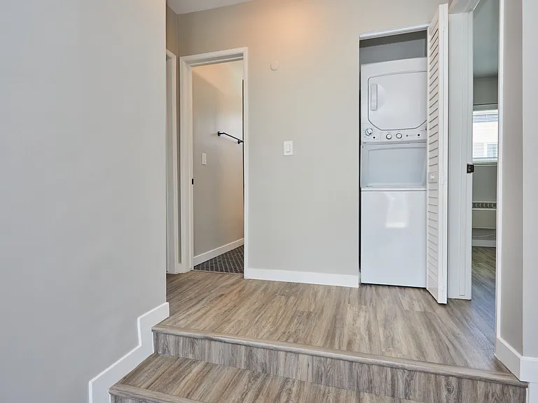 Hallway with washer and dryer