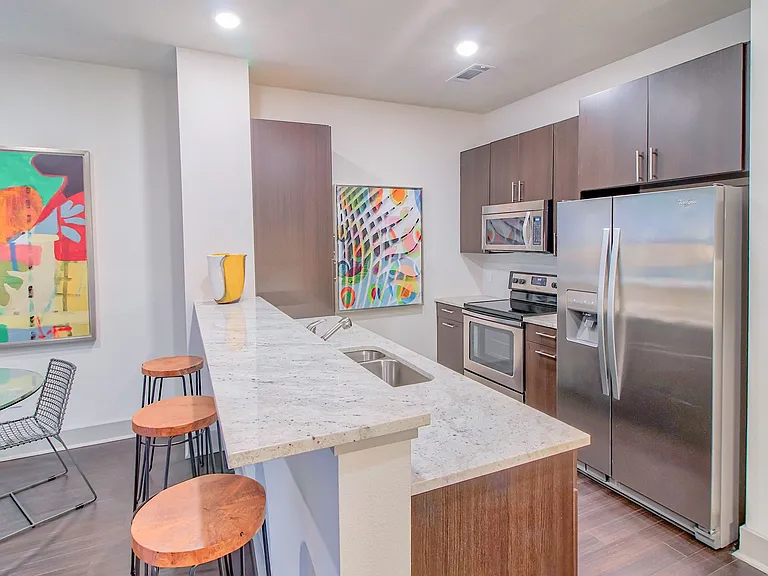 Granite countertops with natural stone backsplash