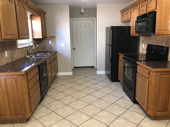 Kitchen view to garage entry and laundry area