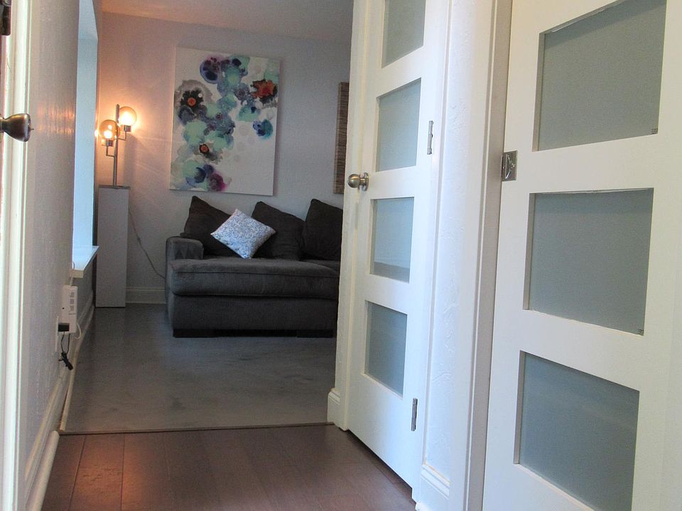 Entryway looking onto kitchen (stairs back to right).