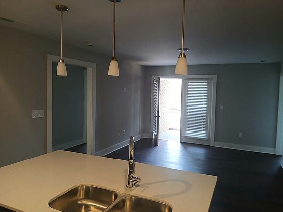 3 BDR Living Area with French doors and patio walk - out or deck. 2 bedrooms and bath to the left and Master and Full Bath to Right