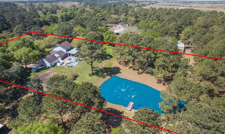 SPECTACULAR 3.293 ACRES SHOWS LIKE A PARK WITH OVER 70 MATURE TREES, POND WITH PIER AND FOUNTAIN, GARDEN, AWESOME OUTDOOR LIVING AREA, POOL AND MORE! 