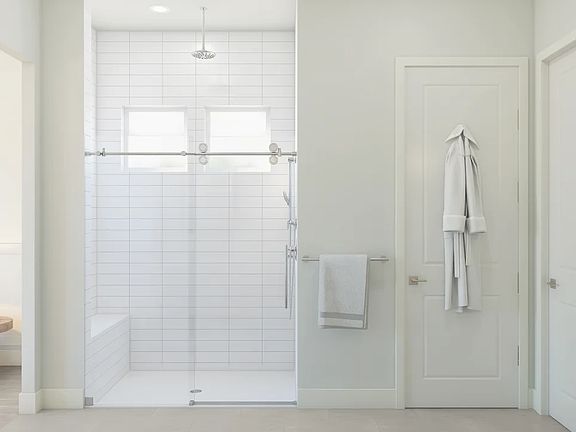 Primary bath with glass shower enclosure