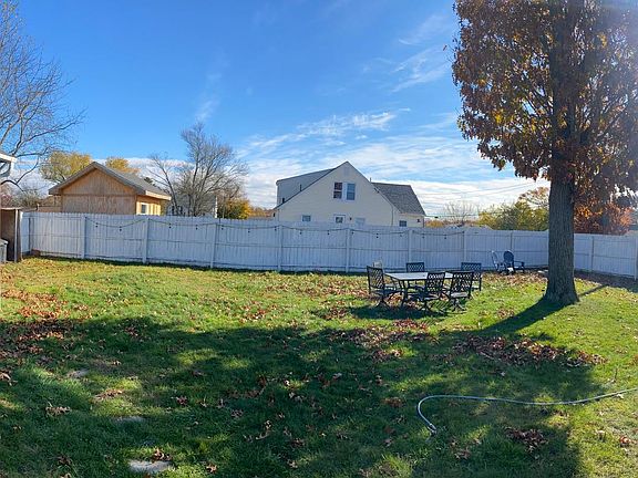 Fire pit, garage/shed, and fenced in back yard