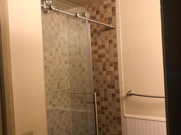 Tile shower with sliding glass door