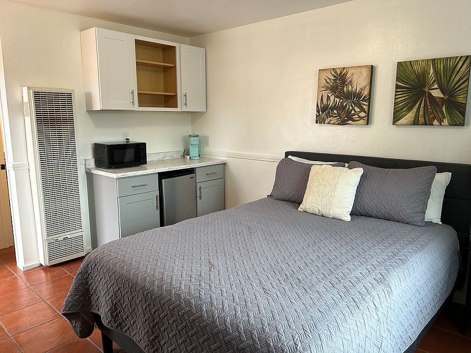 Queen bed and efficiency kitchen