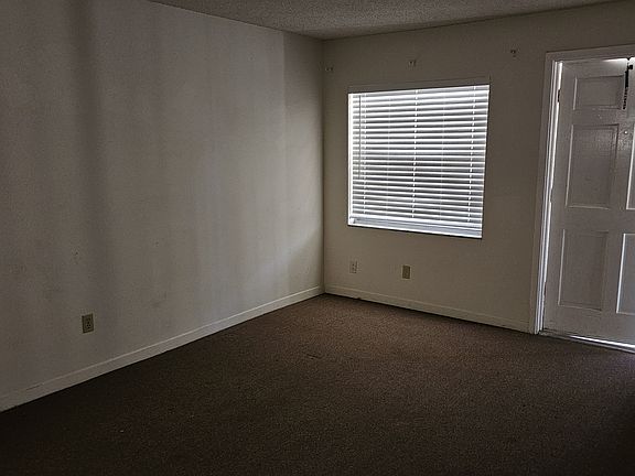 Livingroom looking to front/entry door of unit.