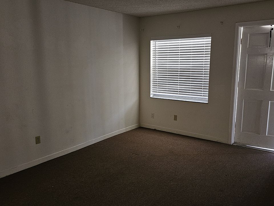 Livingroom looking to front/entry door of unit.