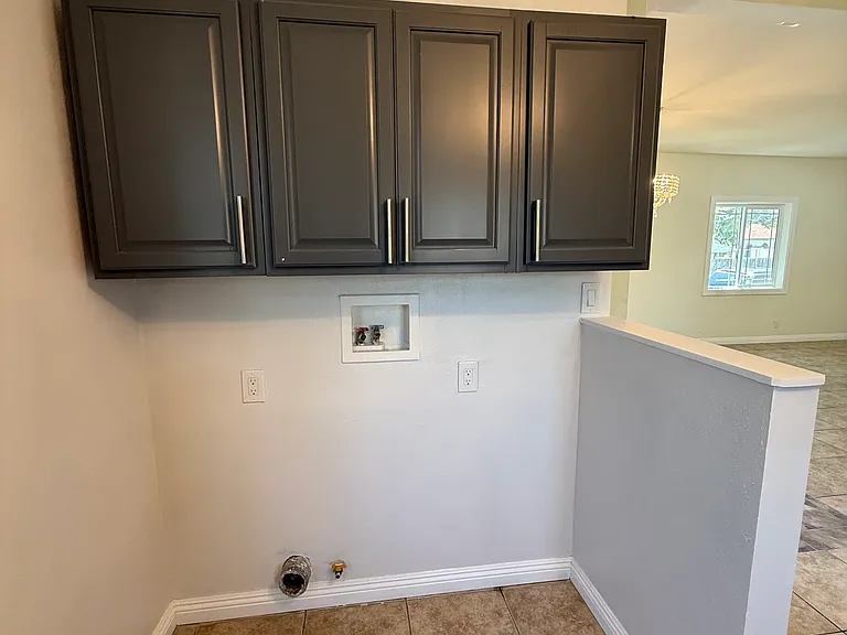 Washer and dryer hookups and cabinet storage