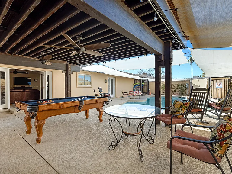 Private back yard with covered patio.