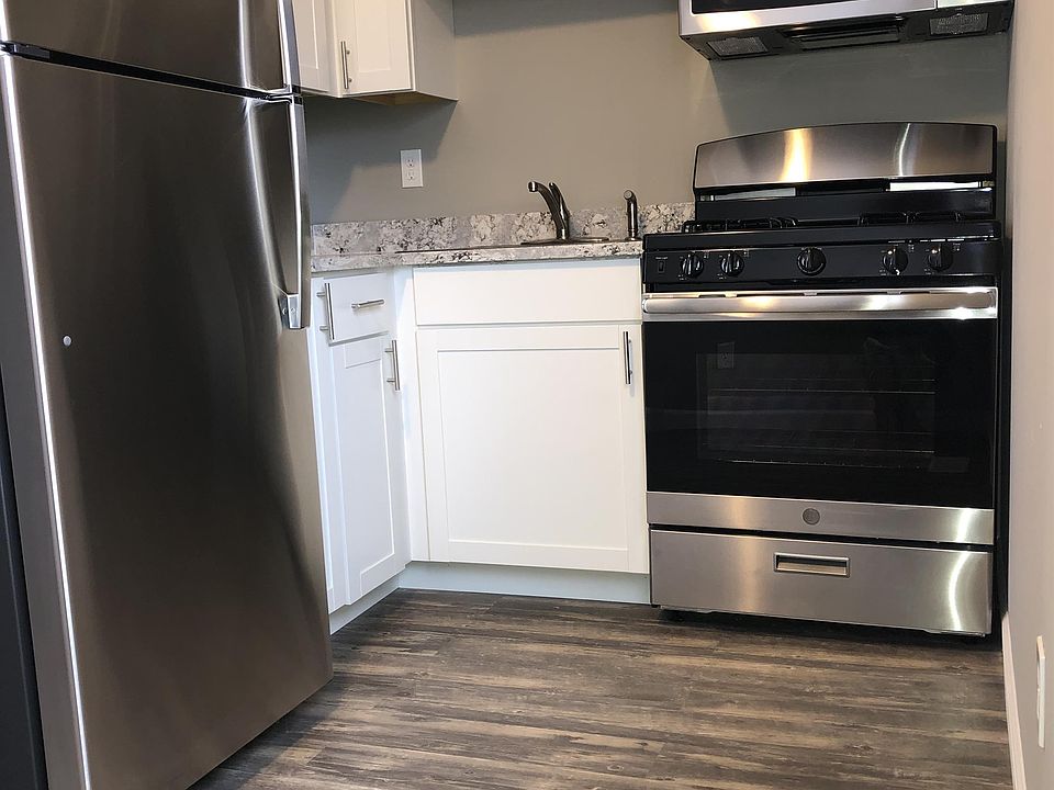 Kitchen has granite countertops, stainless steel appliances and new white saker cabinets.