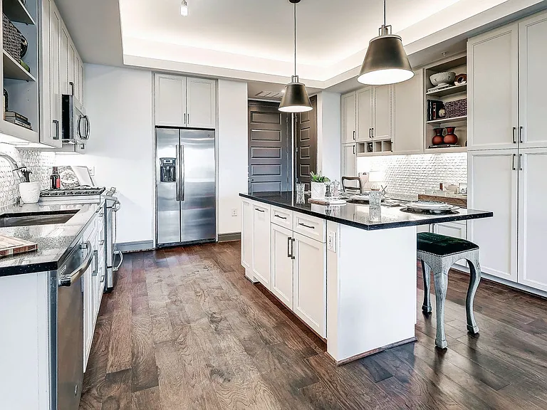 Custom Model Kitchen with Dine-In Gourmet Kitchen Islands, Stainless Steel Appliances, and Gas Ranges Stoves