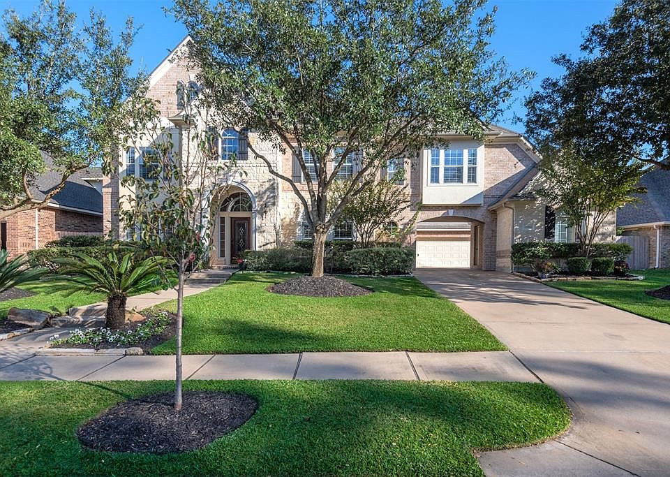 Welcome to this magnificent 5-bedroom Newmark home situated directly across from Eagle Lake in the master-planned community of Windrose!