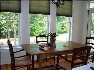 Morning room opens to porches on both sides.