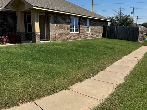 South side view showing stockade fence.