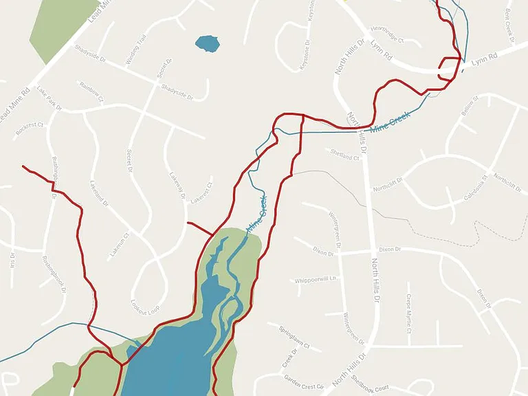 Villagreen home (yellow arrow) with biking/jogging trail (in Red) to Shelly Lake Park. Trails are part of the shaded, paved, creekside Raleigh Greenway that allows you to bike/e-bike all over Raleigh and nearby Parks such as Dorthea Dix Park