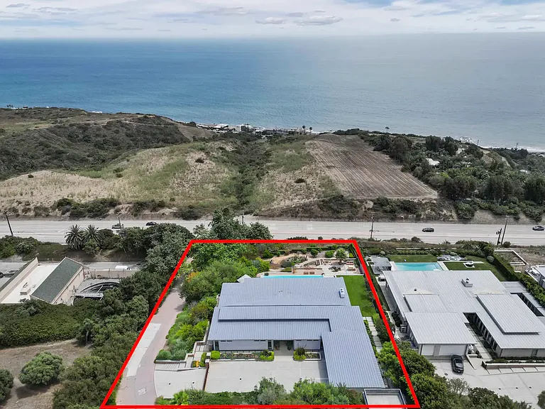 Situated on nearly 2-acres of private, gated property, ensuring utmost privacy.