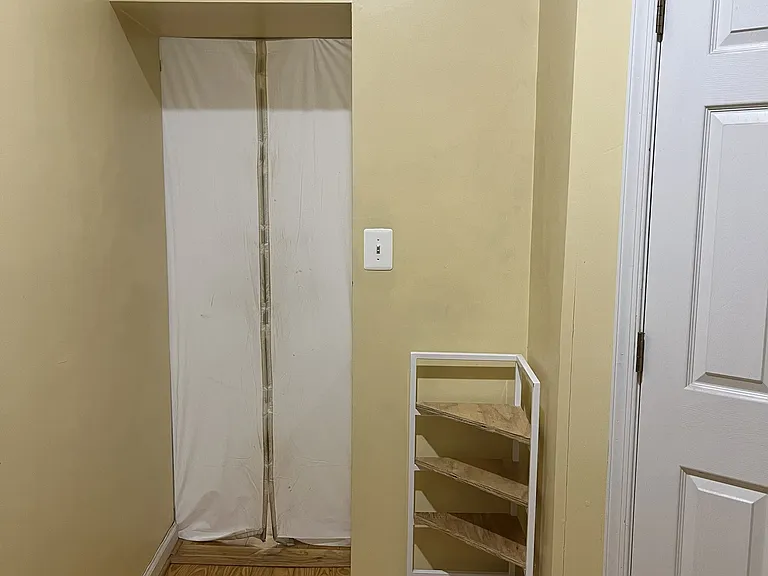 Back mudroom area with utilities and half bath
