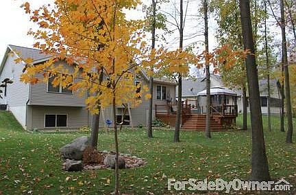 Rear of house
						:
						Deep woods behind house creates a private, outdoor setting with wildlife