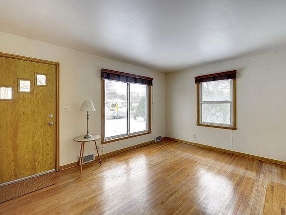 Spacious living room on main level with original hardwood floors