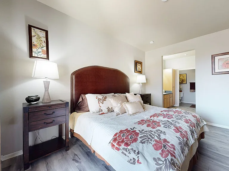 Experience tranquility in this beautifully designed bedroom, perfect for relaxation and comfort.