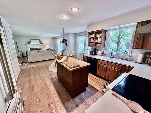 Kitchen, breakfast nook, and den in the background