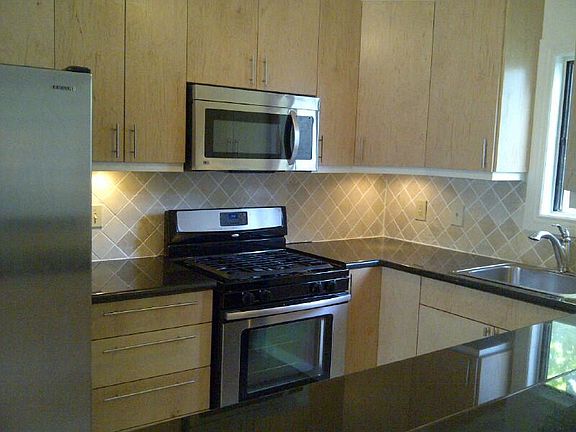 Kitchen with granite counters and stainless steel appliances