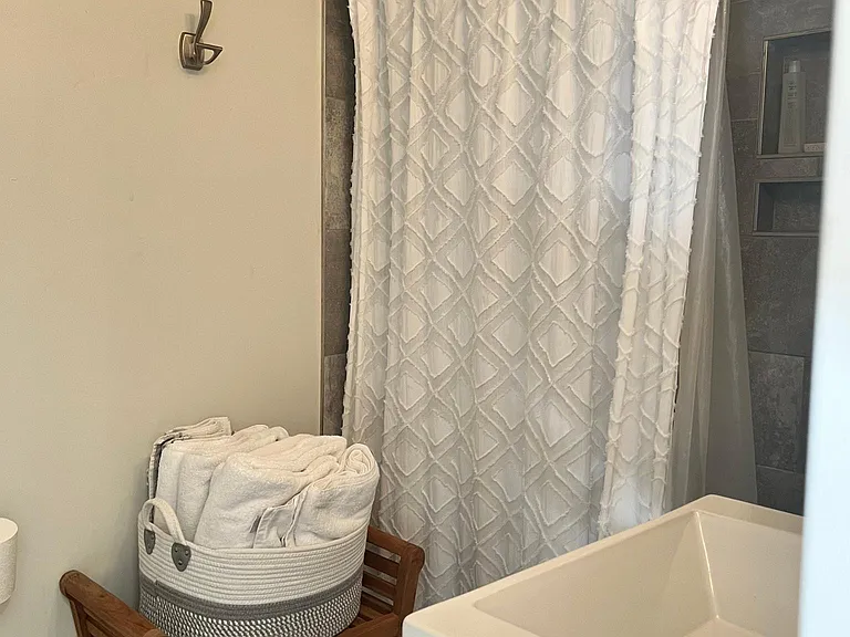 Shower and sink in the bathroom.