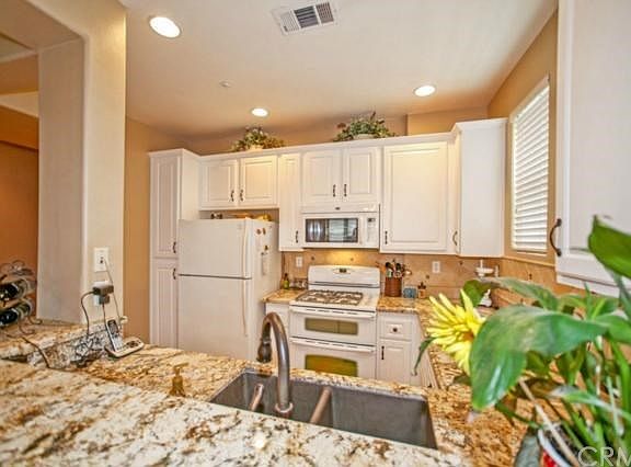 Beautiful kitchen with granite & refaced cabinets
