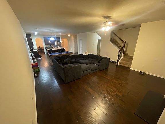 Downstairs Living room this is my favorite space in the entire house it's so spacious. We had a lot of great movie nights here