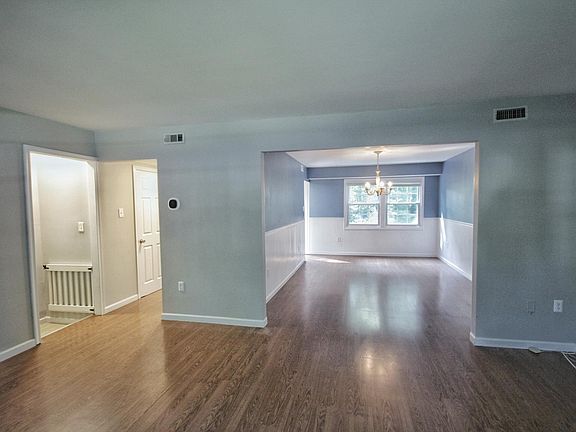 View of Dining Room from the living room with basement doorway on the left